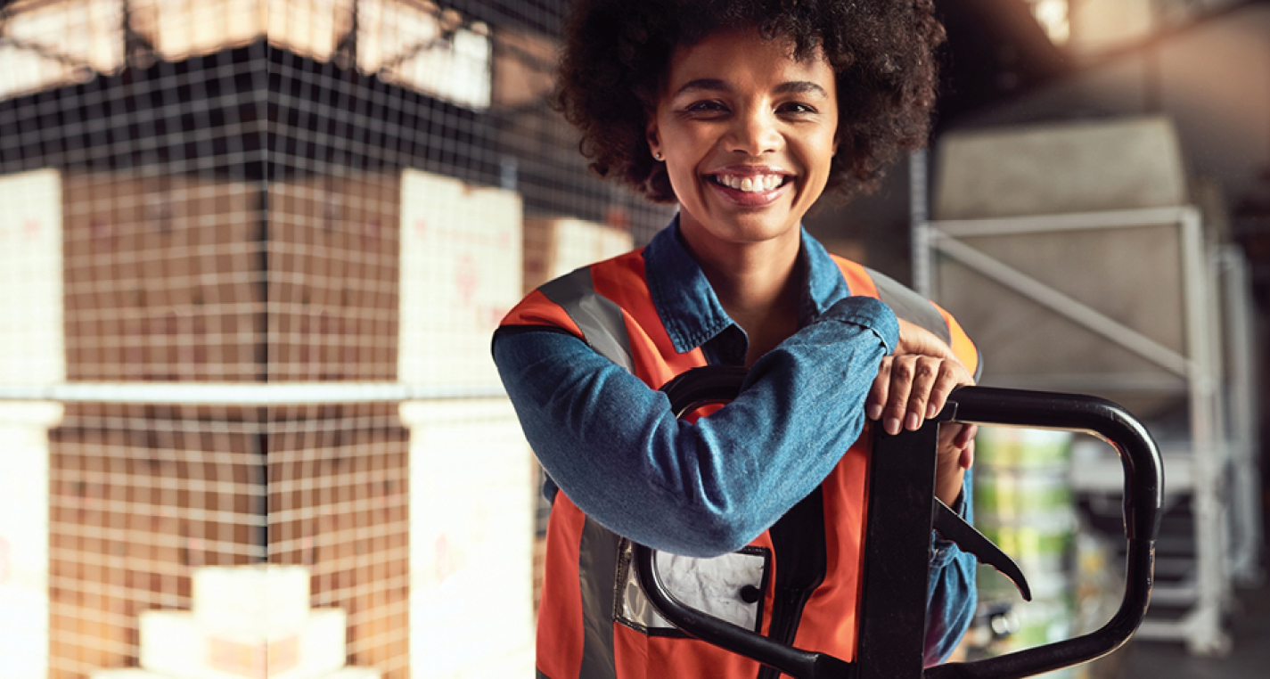 Smiling girl at warehouse from a temporary staffing agency